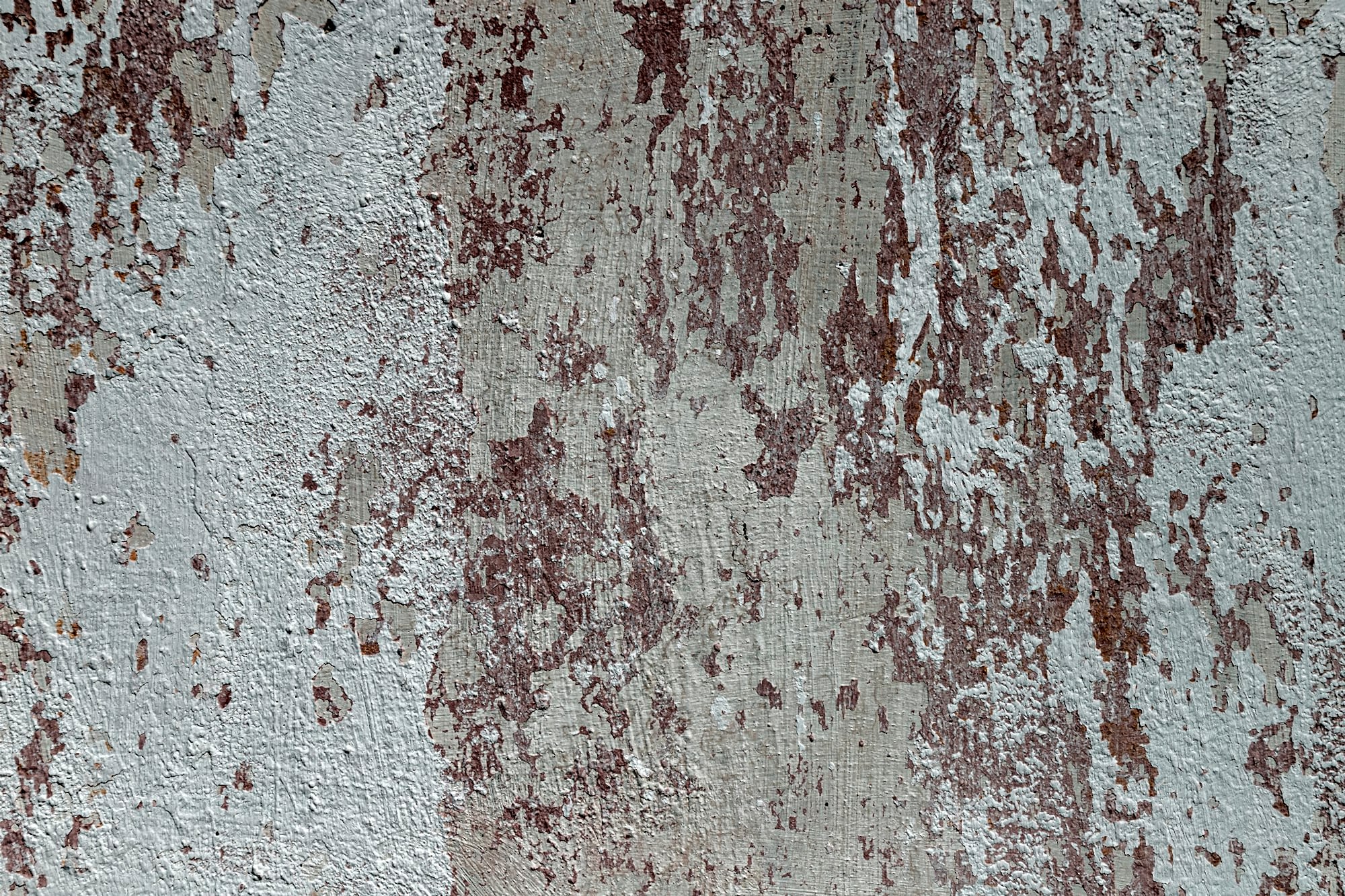 Peeling whitewash on a plaster wall